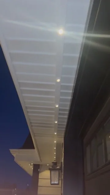 Detail of real Kussmaul Co. permanent lighting warm-white track along a soffit
