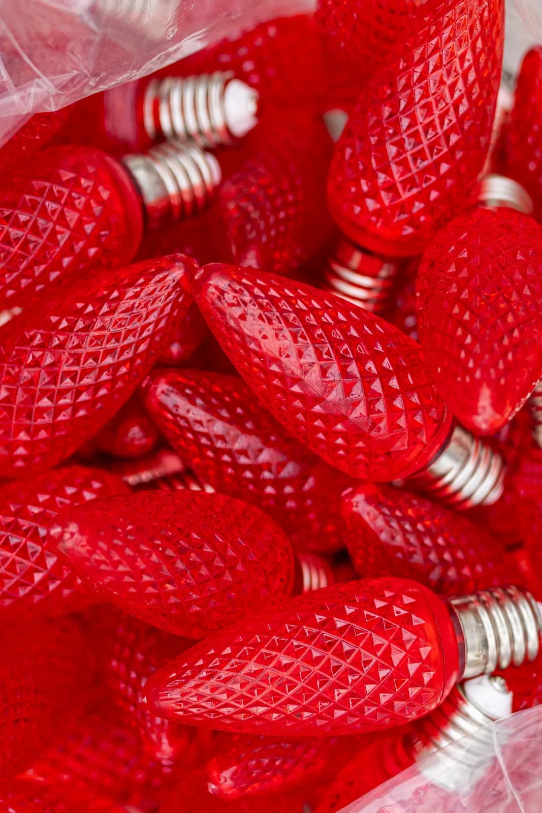 Macro detail of faceted red C9 bulbs used in a real Kussmaul Co. holiday lighting install