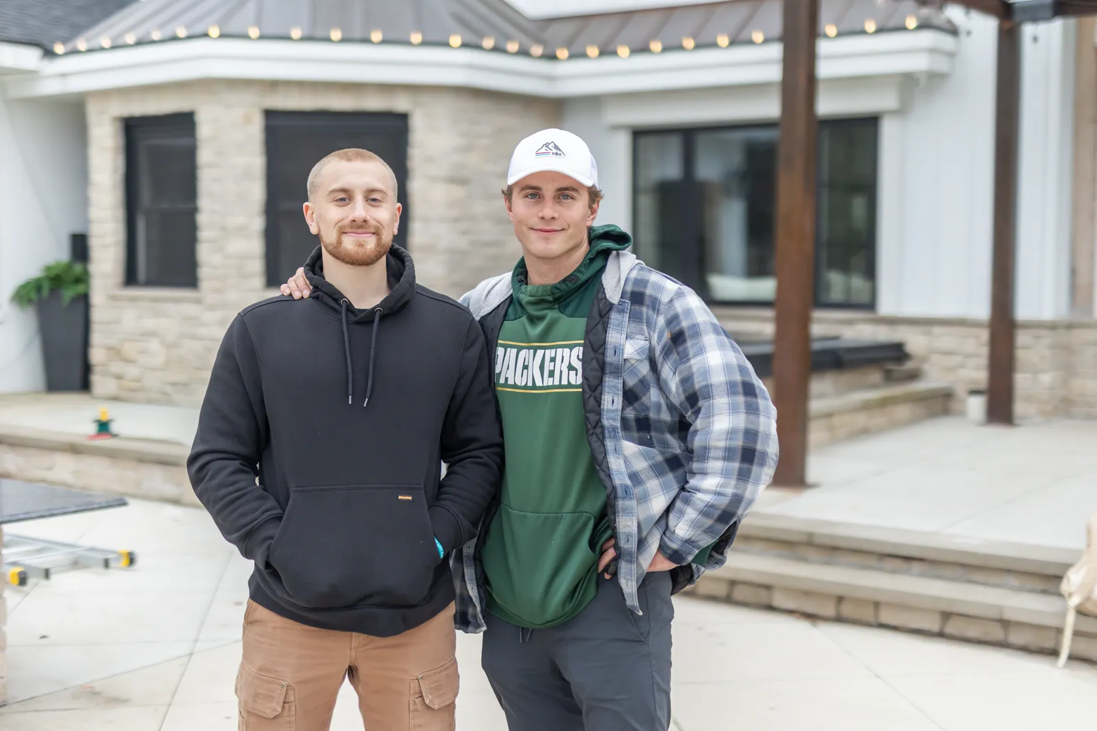 Two Kussmaul Co. crew members at a completed job site
