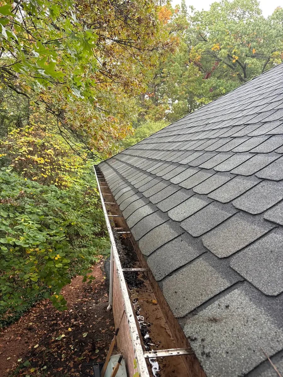 Same gutter cleared and flowing after Kussmaul Co. cleaning