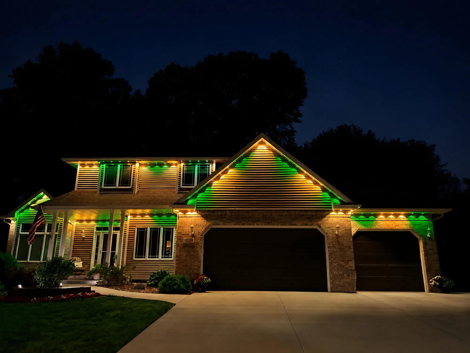 Real Kussmaul Co. permanent lighting in green and gold game-day colors across a full home