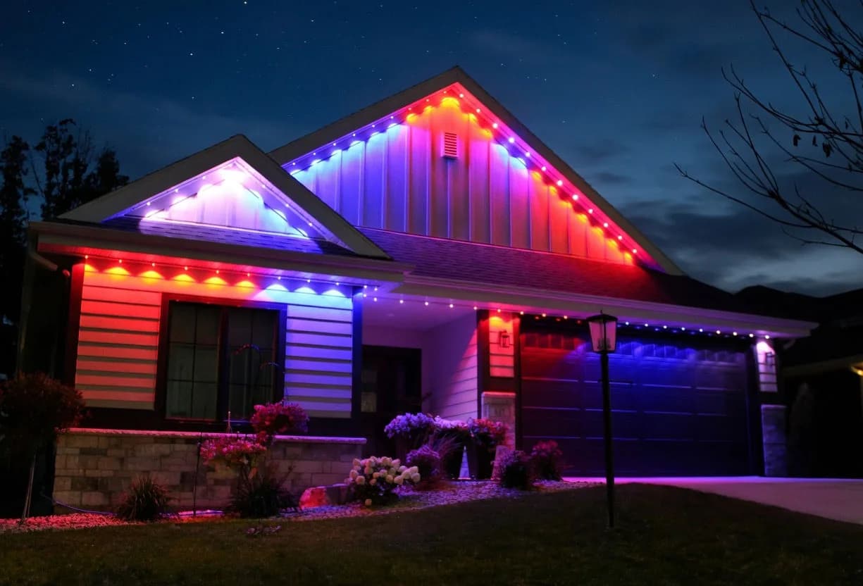 Real Kussmaul Co. permanent lighting in red, white and blue across a home for the Fourth of July