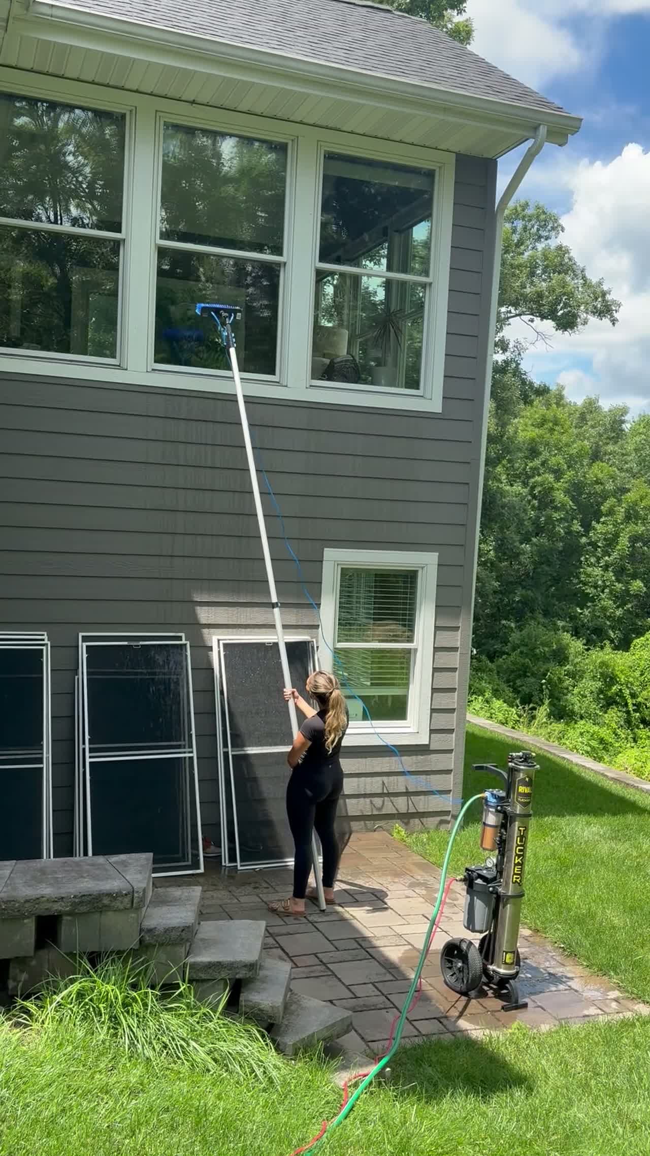 Real Kussmaul Co. crew member clearing a gutter and soffit